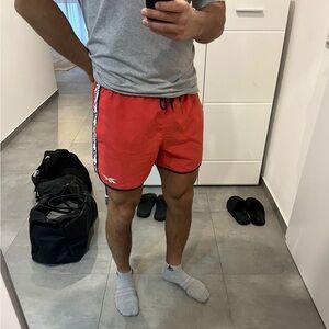 Reebok men’s red shorts for the beach